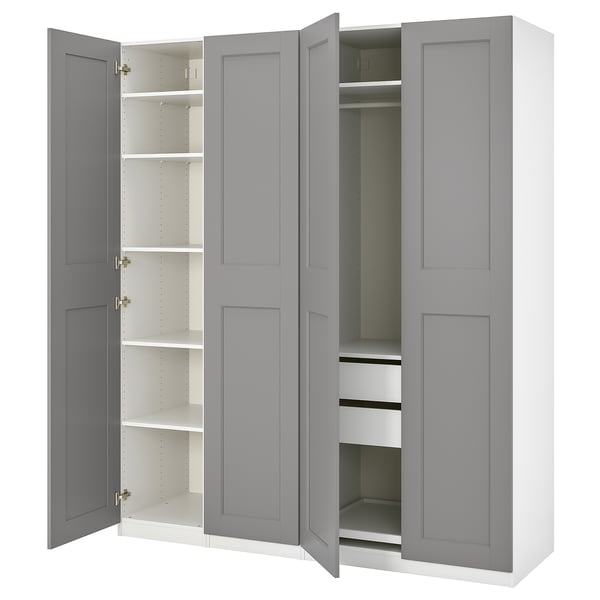 En grå ikea PAX-garderob med öppna dörrar som avslöjar hyllor och lådor inuti.