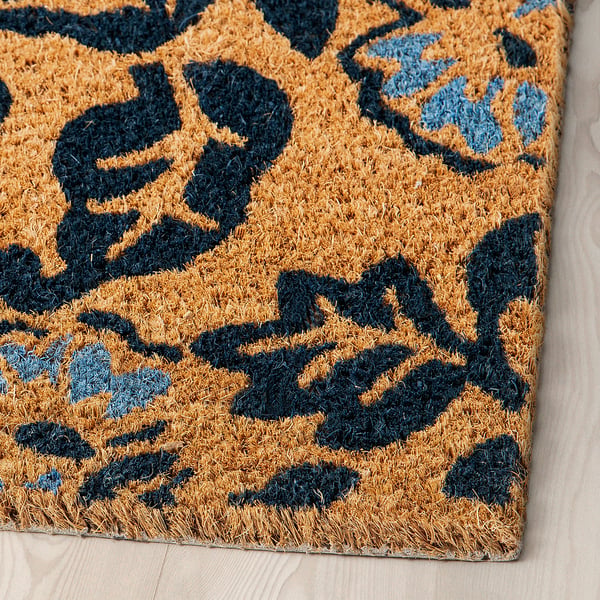 Dörrmatta med leopardmönster i bruna och blå nyanser; Naturlig kokosfiber garanterar hållbarhet och stil.