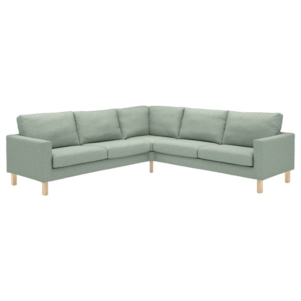 Modern ljusgrön hörnsoffa, fyrsitsig, träben, rak design.