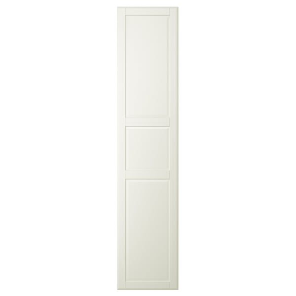 En krämfärgad TYSSEDAL skåpdörr med paneldesign och rundade kanter.
