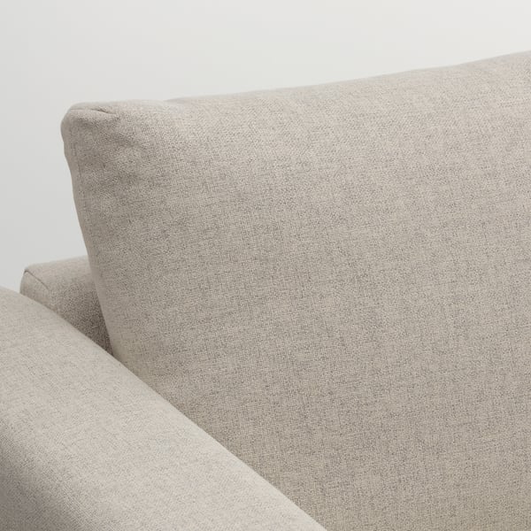Beige soffa, minimalistisk design, rena linjer, robust tyg, polerad finish.