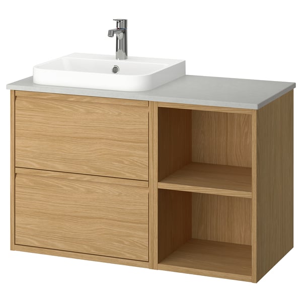 An ÄNGSJÖN bathroom cabinet in oak with a white quartz countertop and a rectangular white sink.