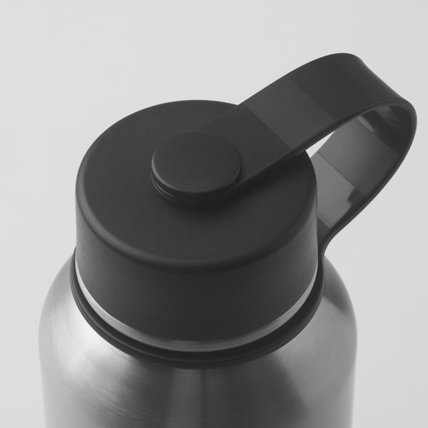 Stainless steel bottle with black lid; secure loop handle, round button on top; smooth, durable texture.