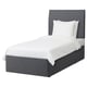 A grey BALESTRAND bed with white linens and a grey upholstered headboard and frame.