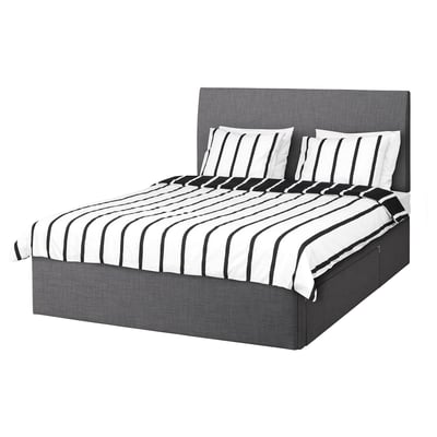BALESTRAND bed in grey fabric, rectangular, with black and white striped bedding.