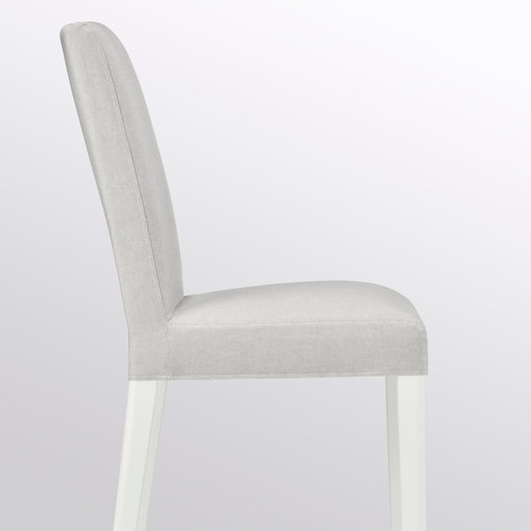 Modern dining chair with curved back, cushioned seat, and light grey upholstery on white legs.
