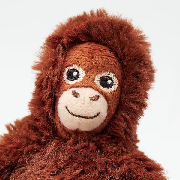 Cuddly plush orangutan, soft, eco-friendly. Embroidered smile & eyes, huggable.