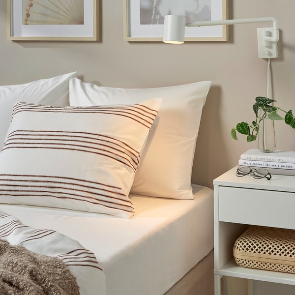 DVALA fitted sheet in brown stripe, natural cotton, fits 26 cm mattress, soft & durable.