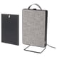 Image displays a grey FÖRNUFTIG air purifier with a removable handle, standing on a metal stand.