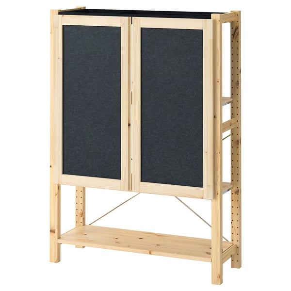 IVAR storage unit in natural pine with two dark grey felt doors and shelves. Simple, sturdy, and versatile design.