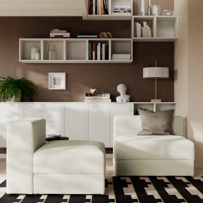 Modern living room with light green JÄTTEBO sofa, rug, storage, and shelves.