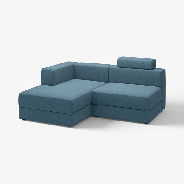 Blue modular sofa, rectangular shape, soft fabric with high back and attached seat.