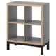KALLAX grey shelf unit, four cube compartments, sleek modern design with light wood trim and black base, versatile for various uses.