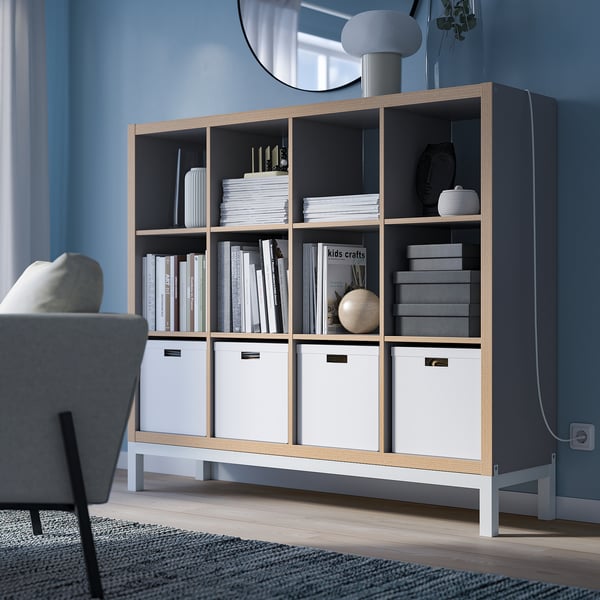 KALLAX shelf in modern living room with books & decor.
