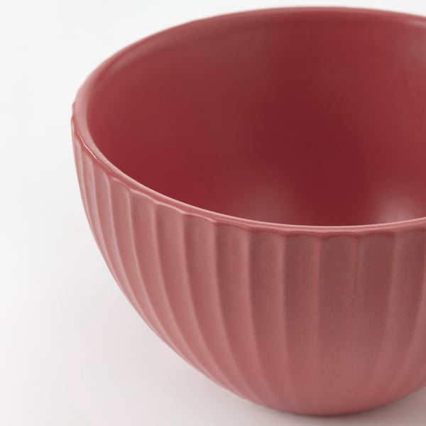 Red bowl with ribbed grip.