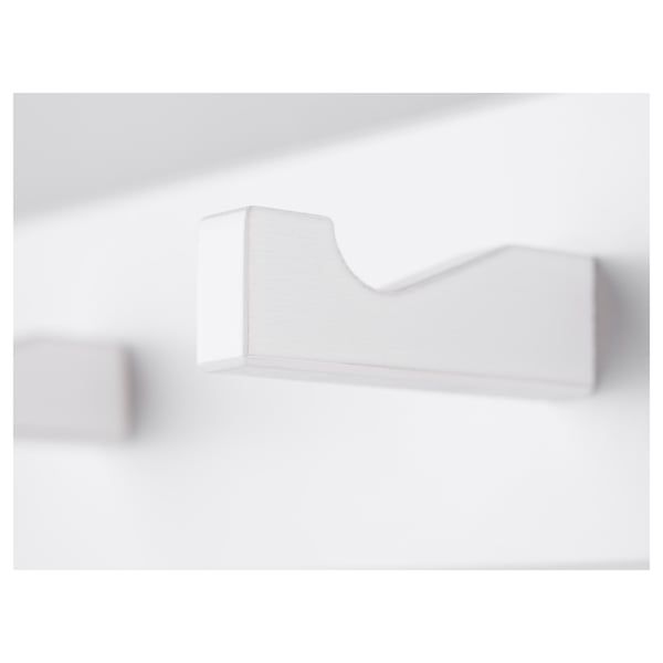Minimalist white wall rack, mounted securely, ideal for organising small items.