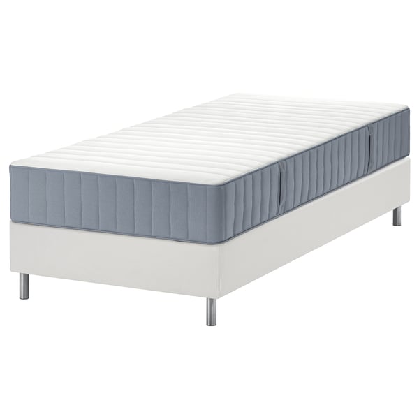 White LYNGÖR bed base with grey mattress, modern design, padded headboard, pocket springs for comfort.