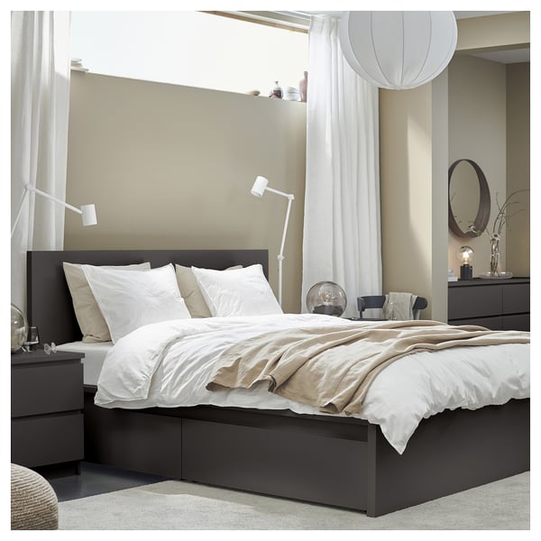 Modern bed with storing drawers, minimalist design, includes headboard, neutral colours, fabric, and clean lines.