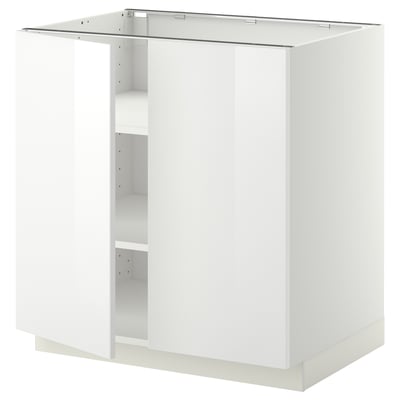 A white ikea METOD kitchen cabinet. Its rectangular, has a glossy finish, and one open shelf.