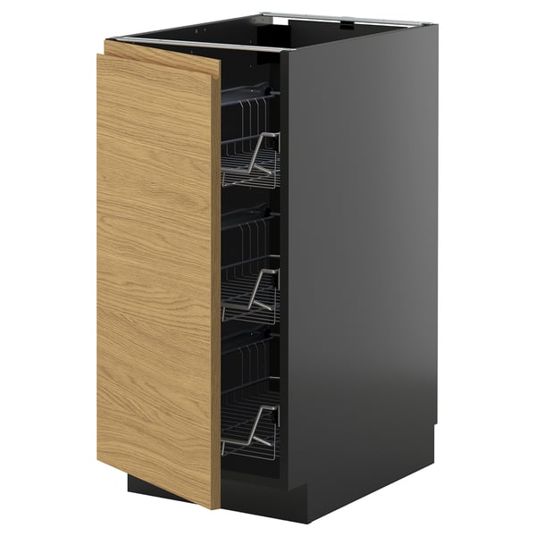A modern kitchen cabinet, named METOD, in black with a wooden finish door, wire shelves, and minimalist design.
