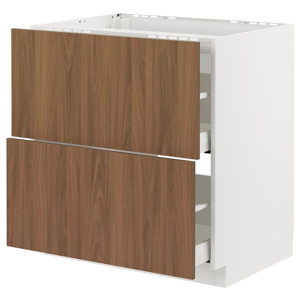Modern kitchen cabinet: METOD with walnut tistorp fronts, sleek design, white frame.