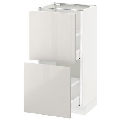 White high gloss METOD kitchen cabinet with two open drawers.