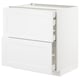 White METOD kitchen unit with closed and open drawers, sleek modern design.