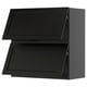 Black kitchen cabinets, two square doors with bevelled edges.