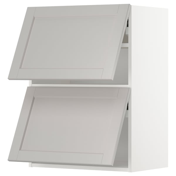 A white METOD kitchen cabinet system with light grey lerhyttan fronts, featuring bevelled edges and a classic, traditional design.
