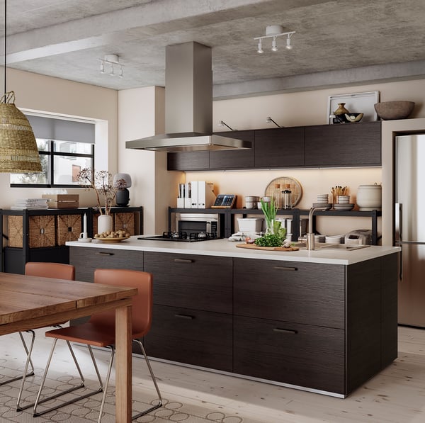 Modern kitchen with dark wood cabinets, stainless steel appliances, and a large island. MITTLED ceiling lights for sleek, industrial design.