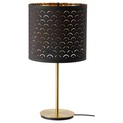 Modern lamp: NYMÖ, black & gold, cylindrical shade with cutouts, brass pole, round base.