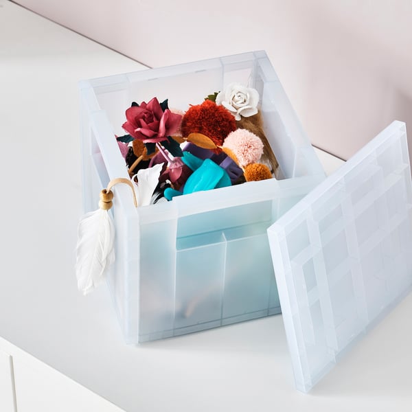 Recycled plastic box with lid, holds colourful items, keeps contents dust-free.