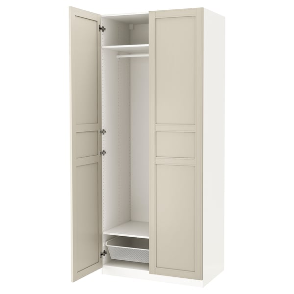 White PAX wardrobe with beige doors, adjustable shelves, and soft-closing hinges.