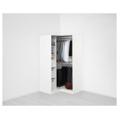 A modern PAX wardrobe, organised with clothes and drawers in a minimalist room.
