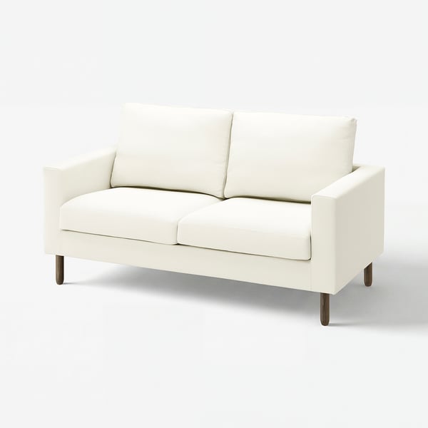 SALTSJÖBADEN off-white sofa, modern minimalist design, white upholstery, wooden legs, clean lines, supportive cushions.