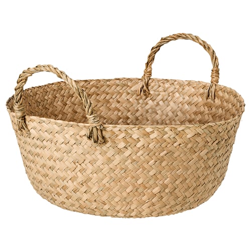 Handwoven basket named SANDJORD in natural sedge colour, featuring a circular shape with two twisted handles for carrying. A rustic, natural design.