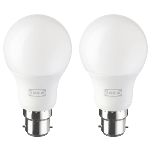 Two ikea SOLHETTA led bulbs, white, globe shape, with metal base, frosted finish.