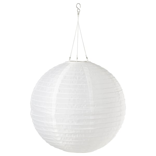 Round white solar lantern hangs from string. Made from recycled pet bottles.
