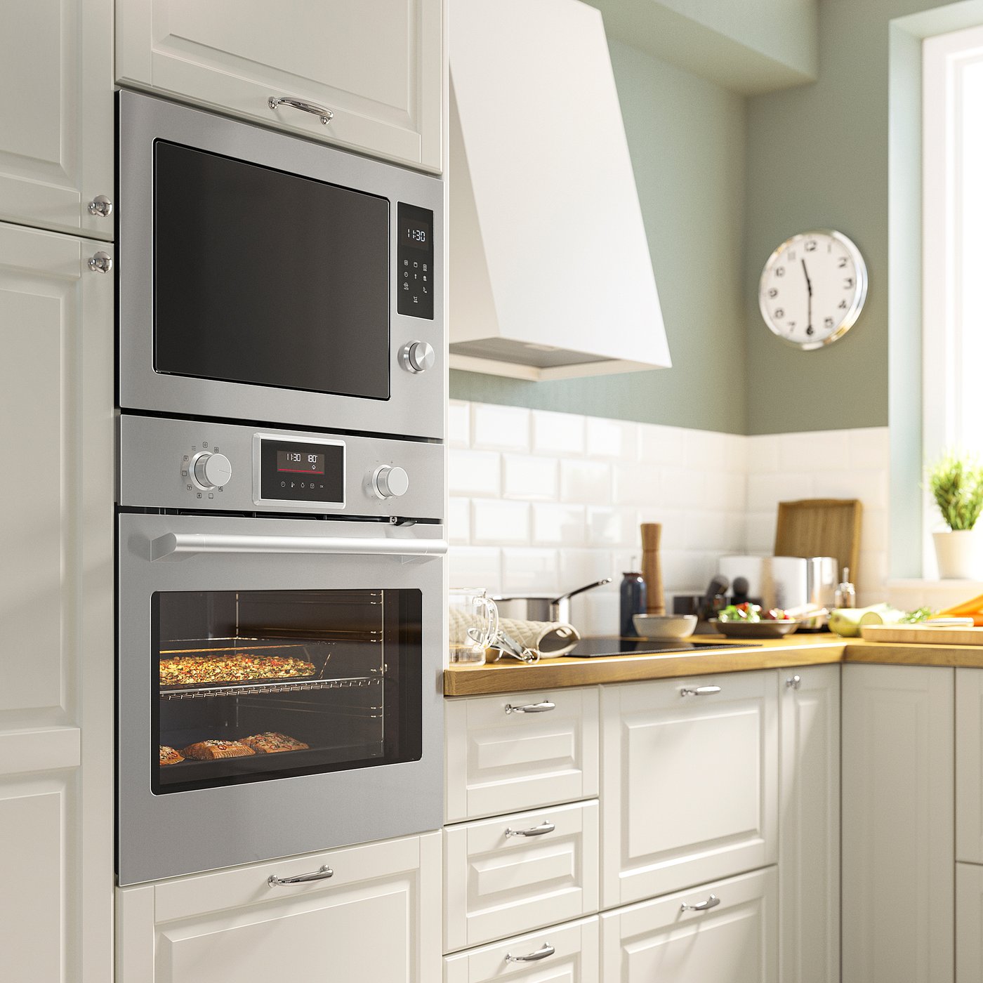 Stenabay microwave installed between white kitchen cabinets with control knobs and digital display.