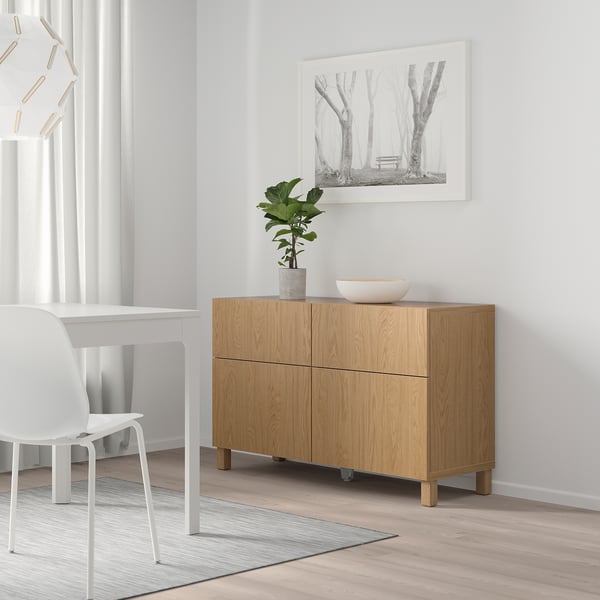 Wooden STUBBARP tv unit with 4 drawers, plant, bowl, nature print.