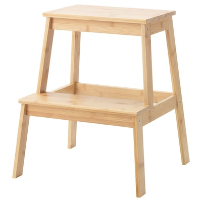 The tenhuts is a light-colored, two-step bamboo stool. Its eco-friendly design is both sturdy and simple.