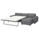 Modern grey sofa-bed with chaise, removable cover, metal frame.