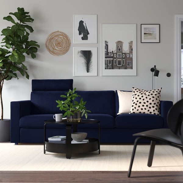 VIMLE navy sofa, modern minimalist design. Centred, its larger than side items.