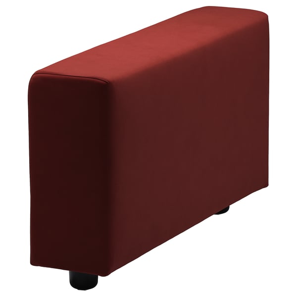 A red, rectangular ottoman with rounded edges and black legs. Its part of the VIMLE collection, designed for comfort and style.