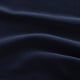 Image depicts close-up texture of velvety fabric, highlighting its soft, rich quality and gentle sheen.