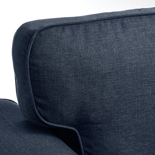 Dark grey sofa with a smooth, neatly stitched fabric. The backrest shows refined tailoring, highlighting the sofas quality.