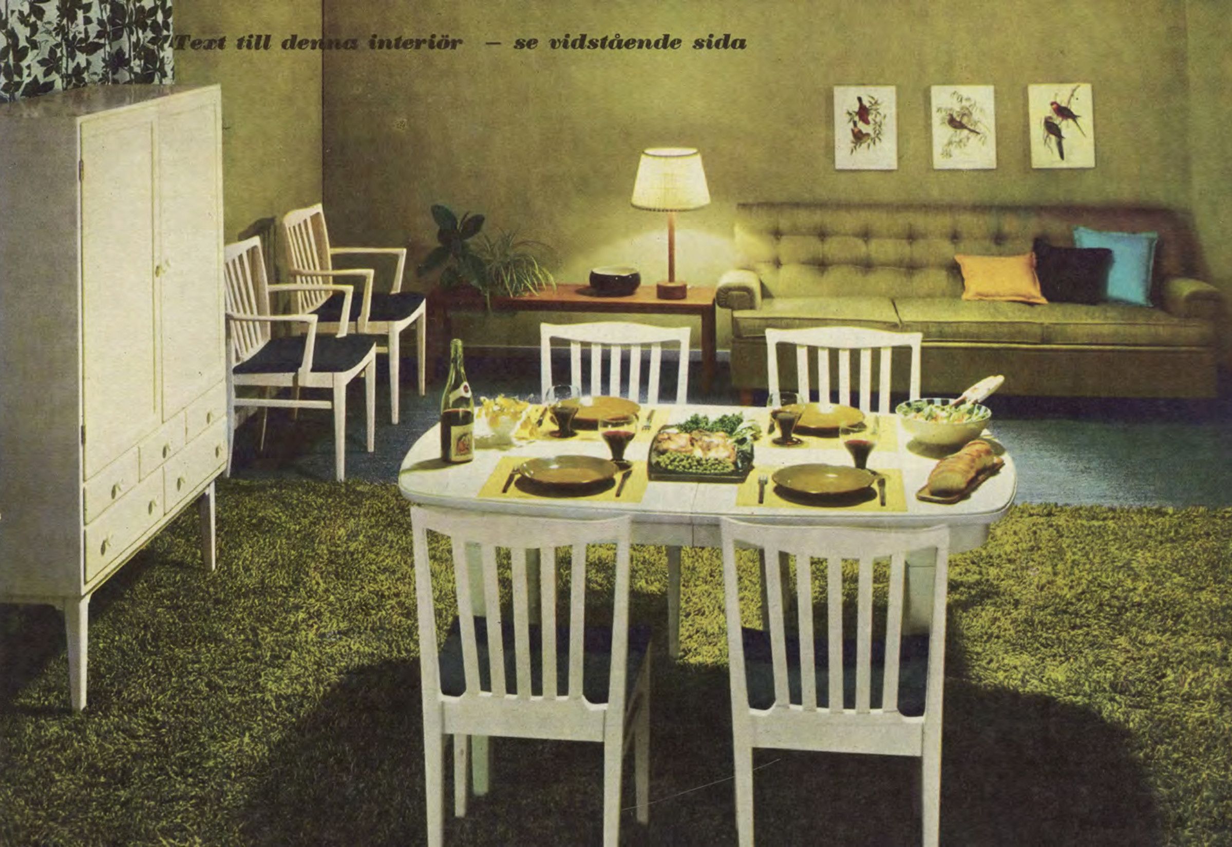 A living/dining room with a large green shag pile rug and a white wood dining room set.