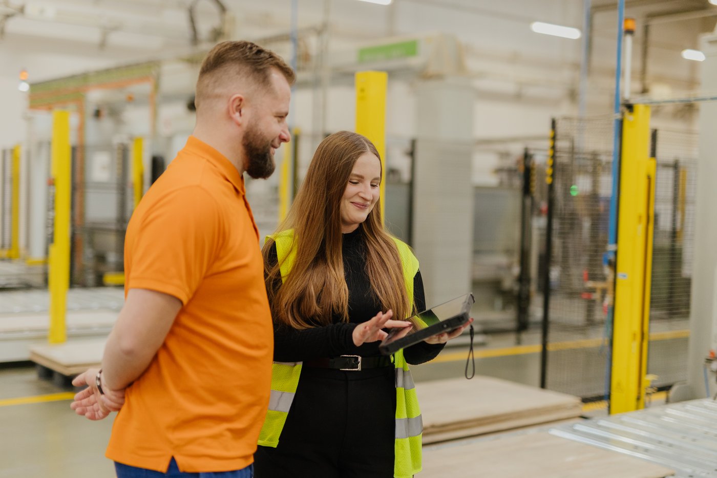 IKEA Industry co-workers talk in a factory in Zbaszynek.