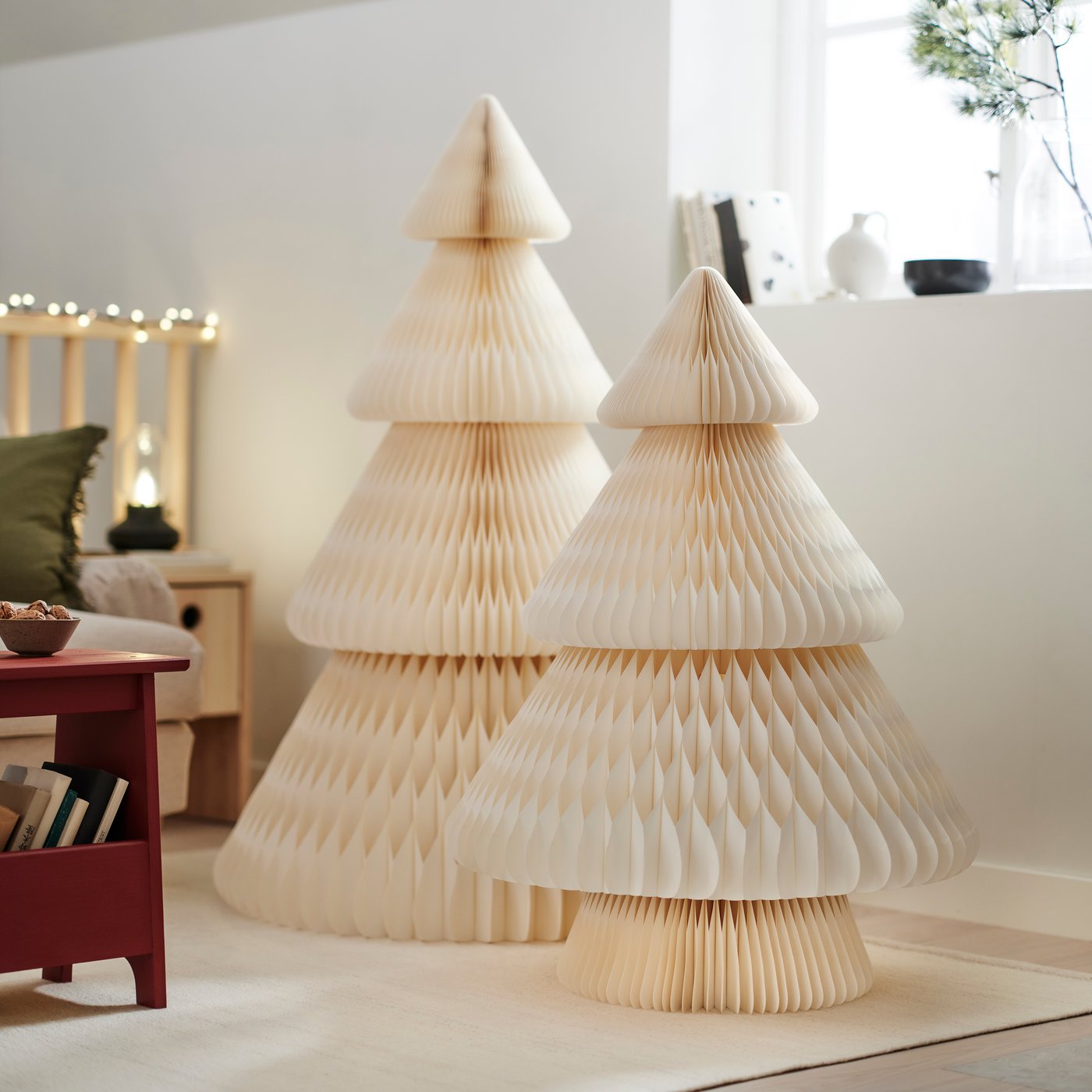 Honeycomb-style paper tree decorations in natural tones displayed indoors.