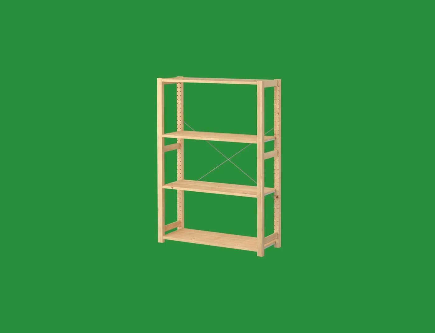 A wooden IVAR shelving unit on a green background.